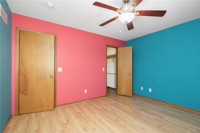 unfurnished bedroom featuring ceiling fan and wood finished floors