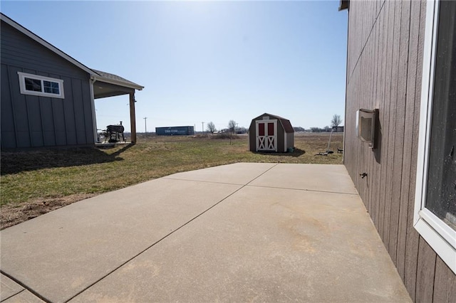 view of patio / terrace featuring a storage shed and an outdoor structure