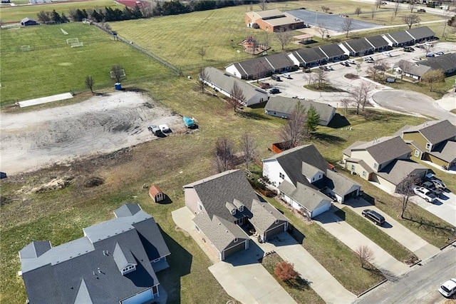 birds eye view of property with a residential view