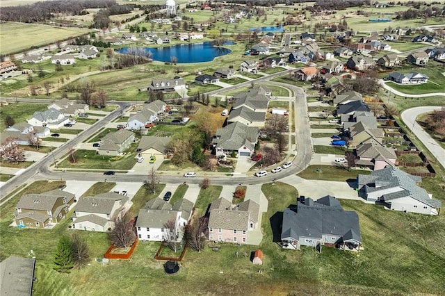 drone / aerial view with a residential view and a water view