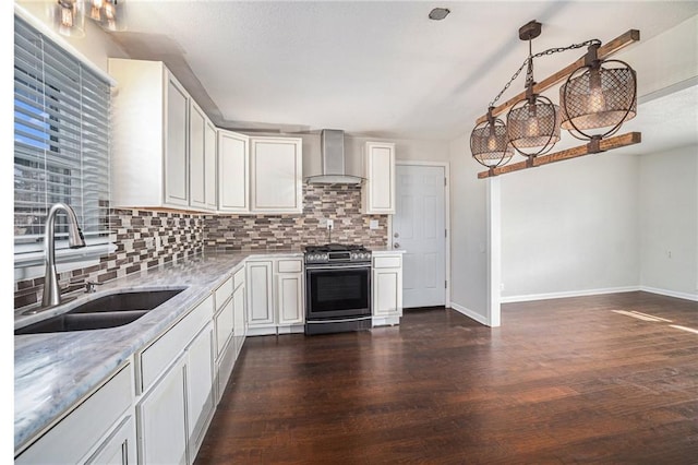 kitchen with stainless steel range with gas stovetop, wall chimney exhaust hood, dark wood-type flooring, and a sink