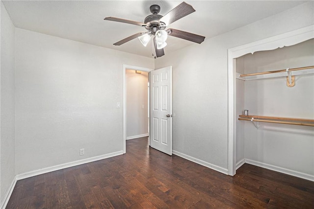 unfurnished bedroom featuring a ceiling fan, wood finished floors, baseboards, and a closet