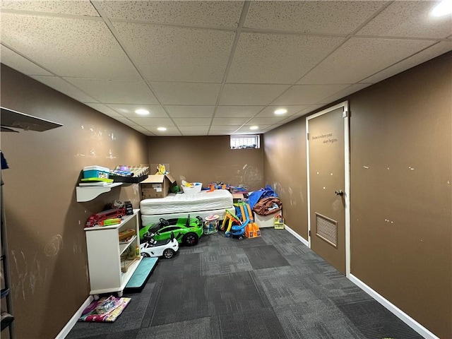 recreation room with carpet flooring, recessed lighting, baseboards, and a drop ceiling
