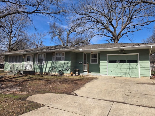 ranch-style house with driveway and an attached garage