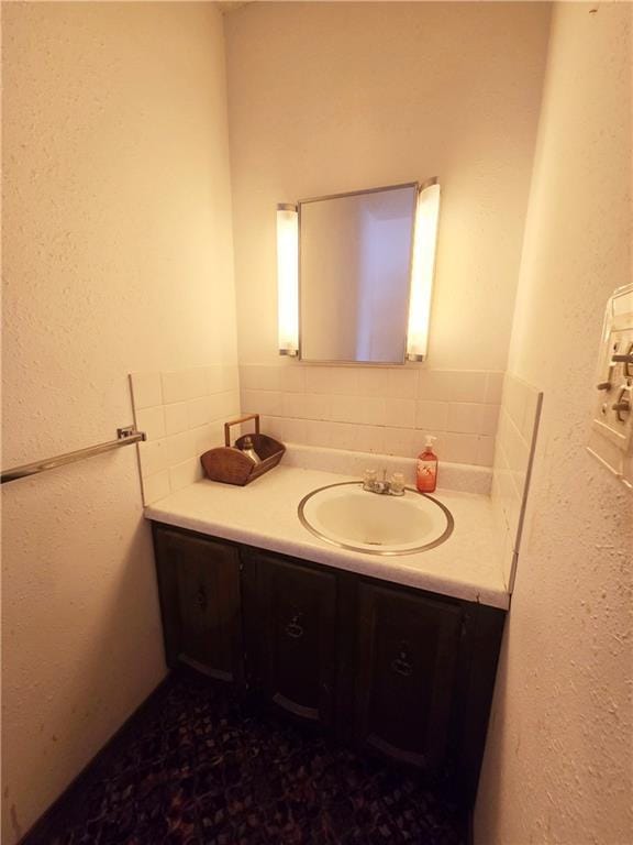 bathroom featuring backsplash and vanity