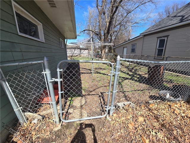 view of yard with a gate and fence
