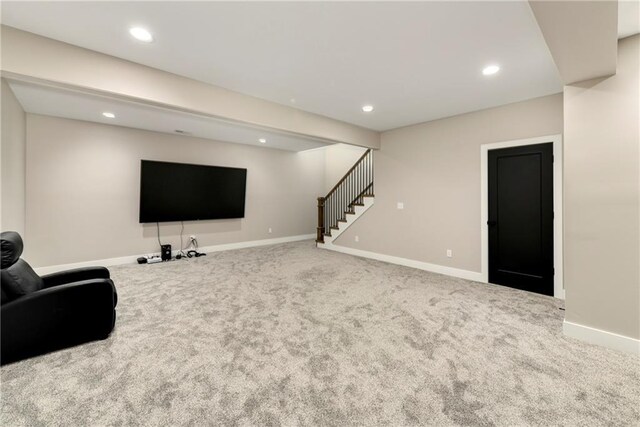 carpeted living room with stairs, recessed lighting, and baseboards