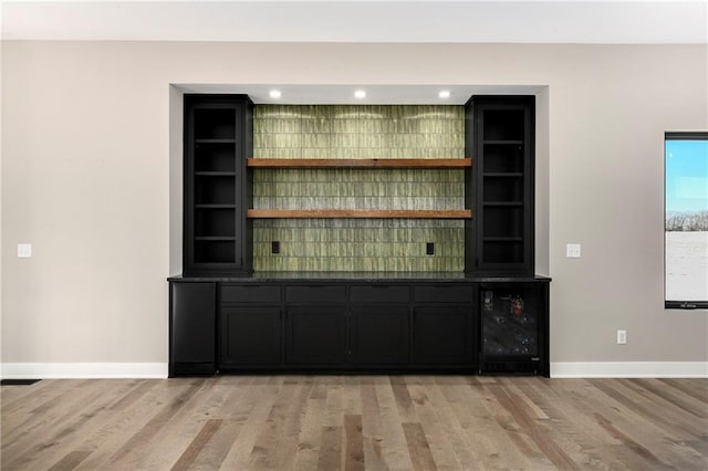 bar with beverage cooler, recessed lighting, light wood-style floors, and baseboards