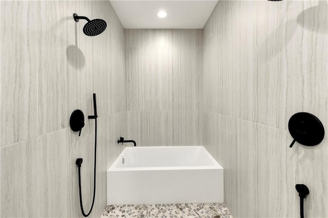 full bathroom with tile walls, a shower, and a tub to relax in