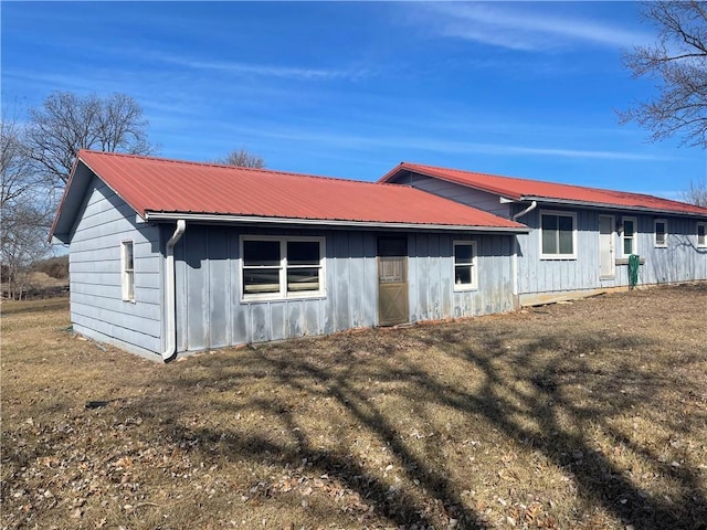 exterior space with metal roof and board and batten siding