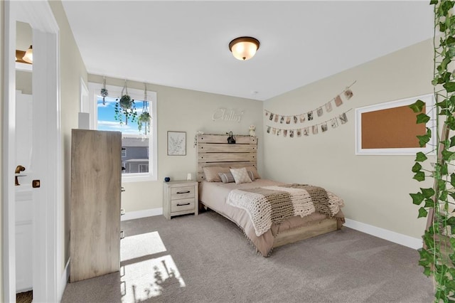 carpeted bedroom with baseboards