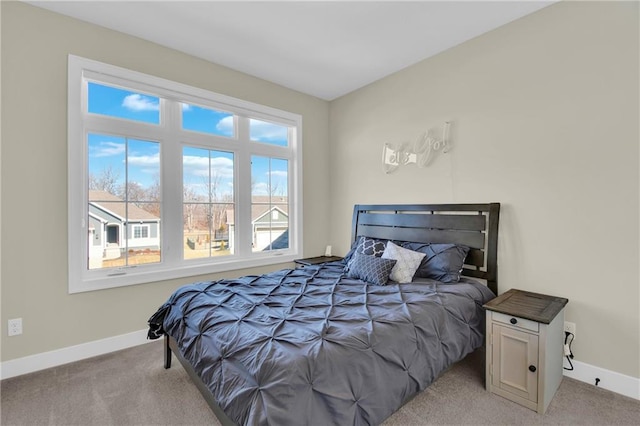 bedroom featuring carpet flooring and baseboards