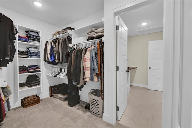 spacious closet featuring marble finish floor