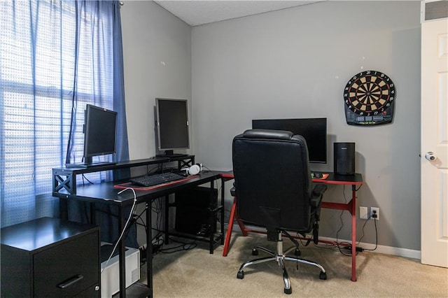 home office with visible vents, baseboards, and carpet floors