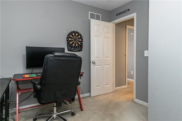 carpeted office featuring baseboards and visible vents