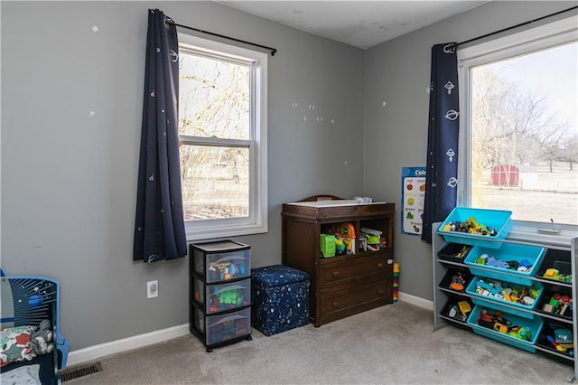 recreation room with baseboards, visible vents, and carpet floors