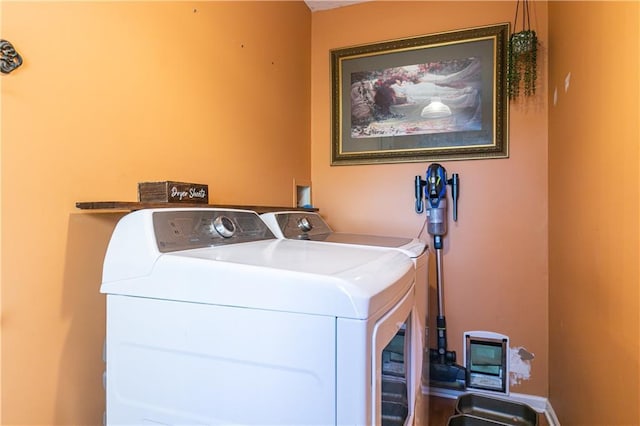 laundry area featuring washer and clothes dryer and laundry area