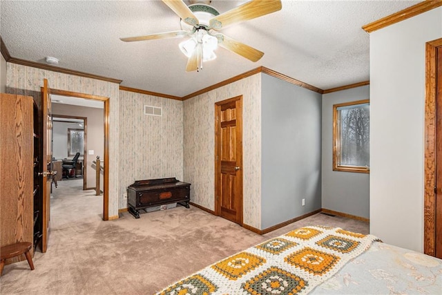 carpeted bedroom featuring visible vents, a textured ceiling, baseboards, and ornamental molding