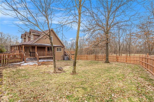 view of yard featuring a fenced backyard, central AC, and a wooden deck