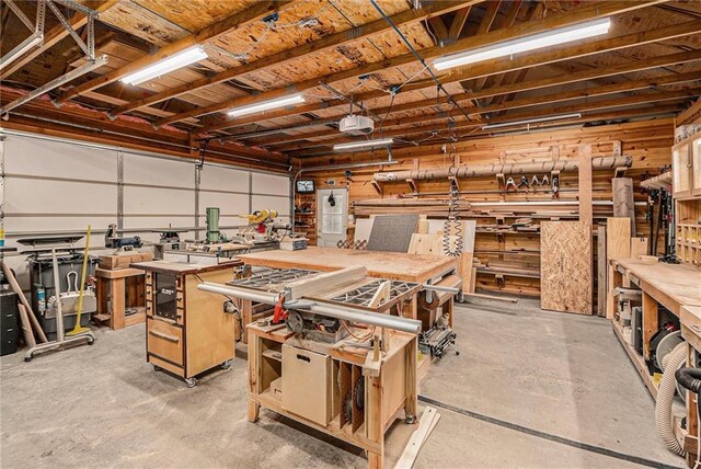 garage featuring a workshop area and a garage door opener