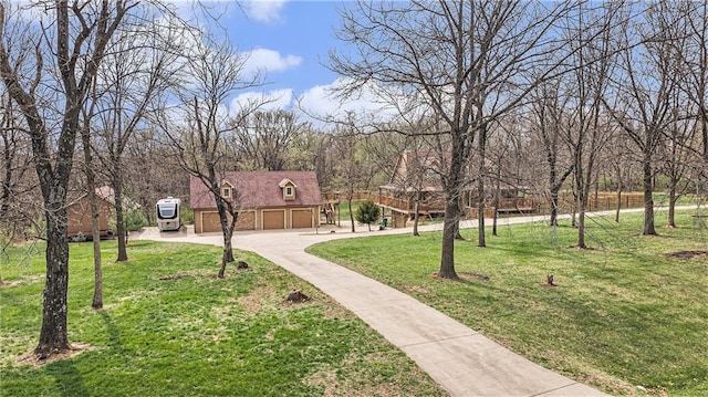 4623 Whispering Oaks Ln, Smithville, MO 64089 - surrounding community featuring a lawn, driveway, and a garage