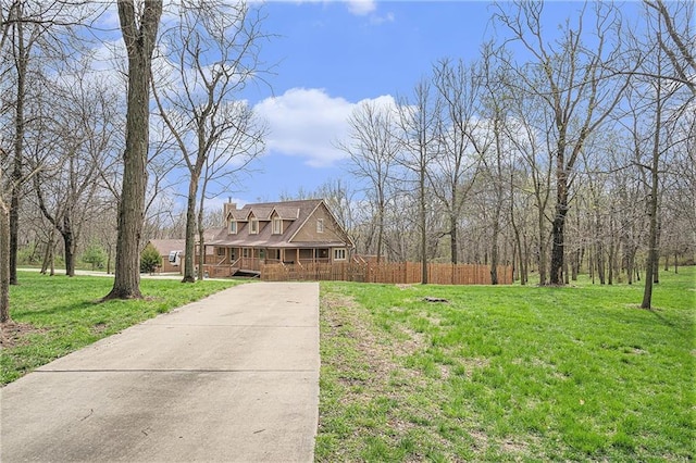 4623 Whispering Oaks Ln, Smithville, MO 64089 - view of front of property featuring a porch, fence, a front yard, and concrete driveway