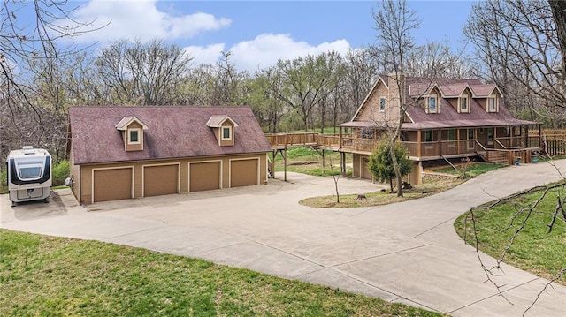 4623 Whispering Oaks Ln, Smithville, MO 64089 - view of property's community featuring a detached garage and driveway