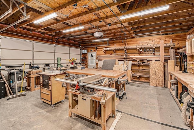 4623 Whispering Oaks Ln, Smithville, MO 64089 - garage with a workshop area and a garage door opener