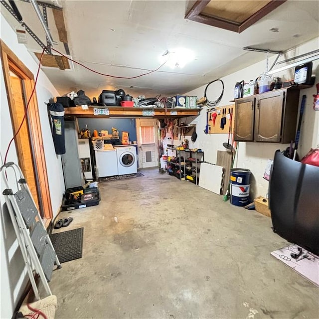 garage with washer and clothes dryer