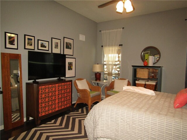 bedroom featuring baseboards and ceiling fan