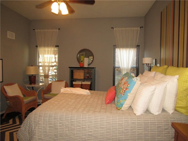 bedroom featuring a ceiling fan and visible vents