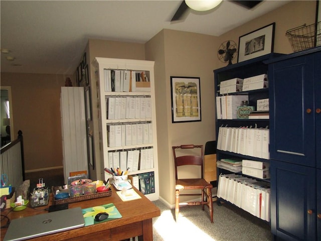 home office featuring a ceiling fan, baseboards, and carpet floors