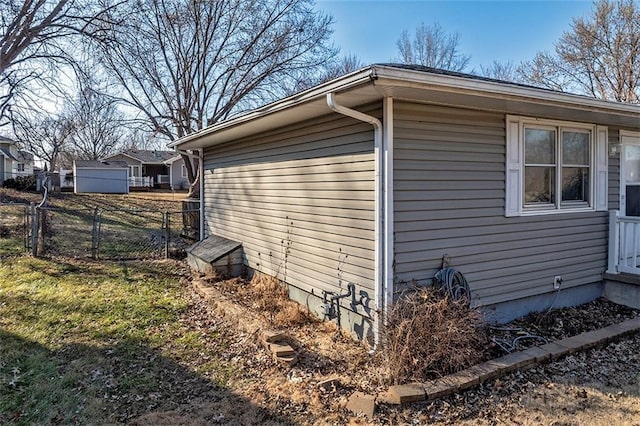 view of side of home with fence