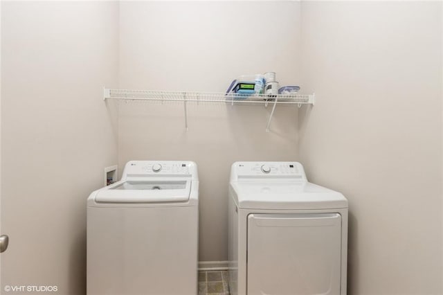laundry room with laundry area and washer and clothes dryer