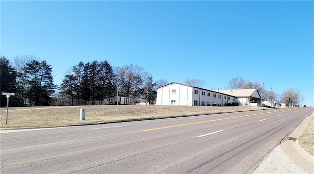 view of road with curbs