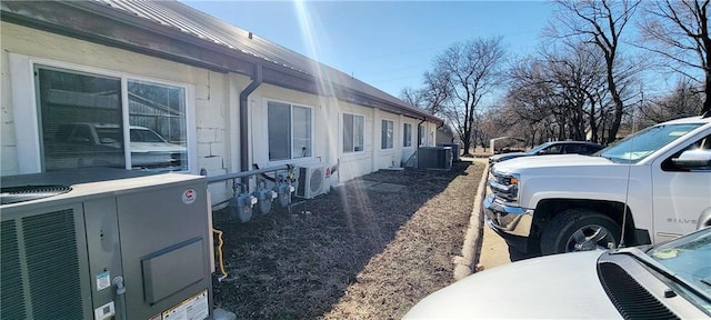 view of home's exterior with central AC unit