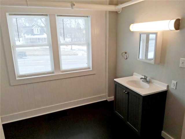 bathroom with vanity and baseboards