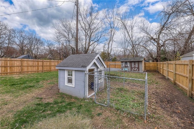 view of shed featuring a fenced backyard