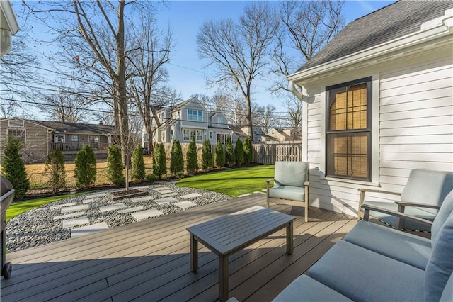 wooden terrace with an outdoor living space, a residential view, and fence