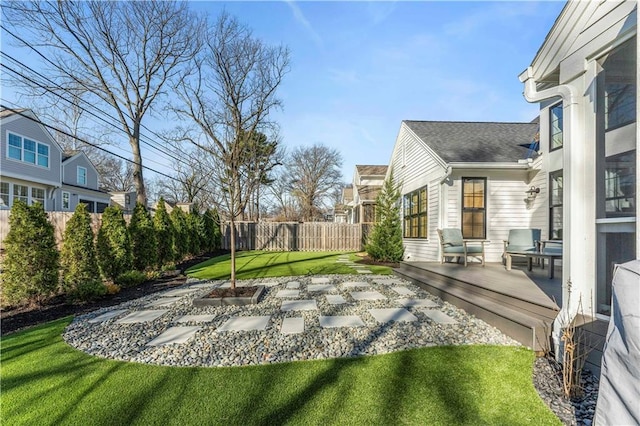 view of yard with a patio area, a fenced backyard, and a wooden deck