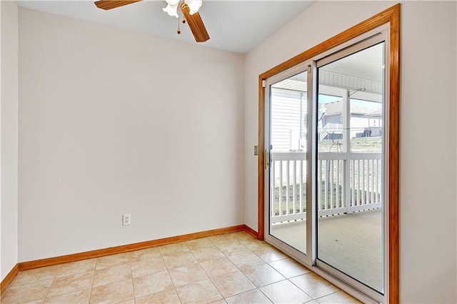 empty room featuring plenty of natural light, baseboards, and light tile patterned floors