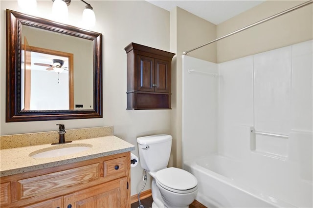 bathroom featuring ceiling fan, toilet, shower / washtub combination, and vanity