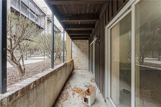 view of side of property featuring brick siding