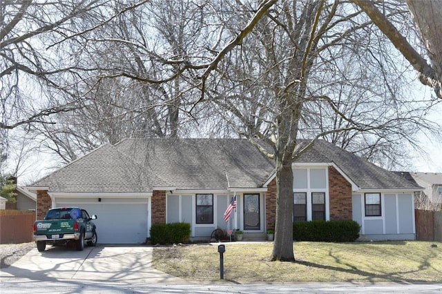 ranch-style house featuring a garage, brick siding, a front lawn, and fence