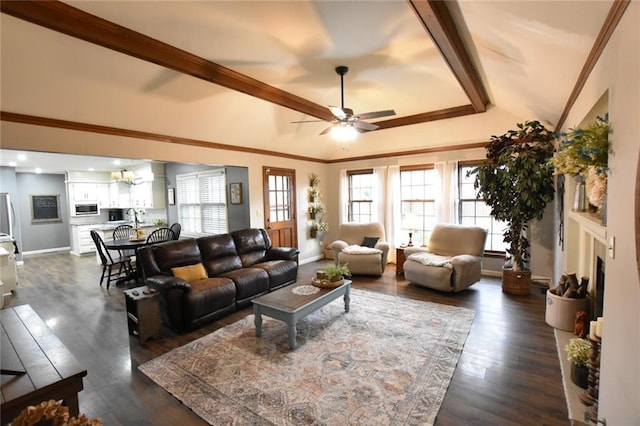 living area featuring crown molding, baseboards, and dark wood-type flooring