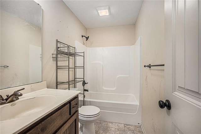 full bath featuring toilet, shower / washtub combination, a textured ceiling, and vanity