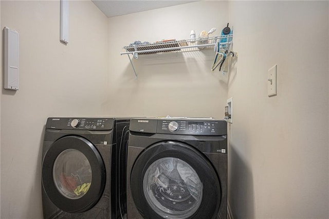 washroom with laundry area and washer and dryer