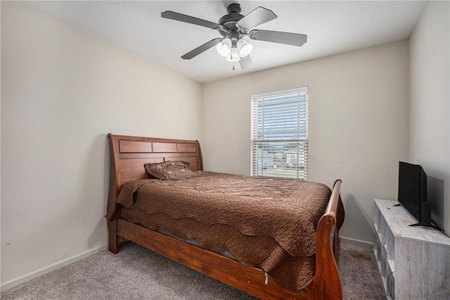 bedroom with carpet floors, baseboards, and a ceiling fan