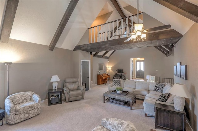 carpeted living room with lofted ceiling with beams and ceiling fan