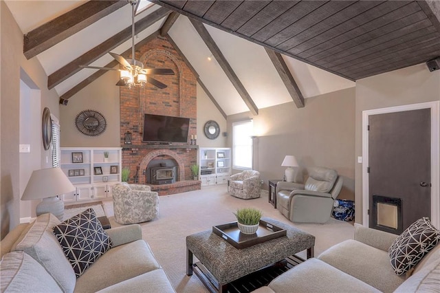 living room with high vaulted ceiling, carpet floors, a fireplace, and beamed ceiling